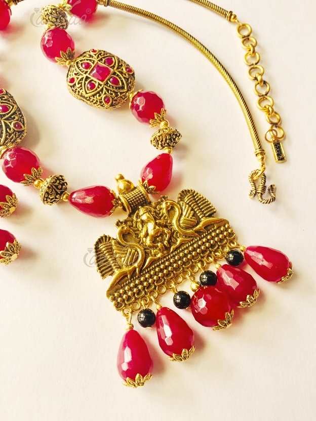 maroon necklace and earrings