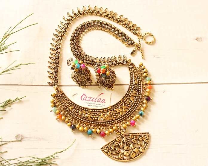 Statement antique gold tone multi necklace earrings set at ₹3550