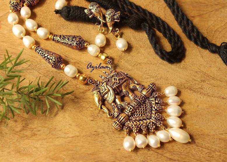 Antique gold tone elephant pendant pearl necklace earrings set