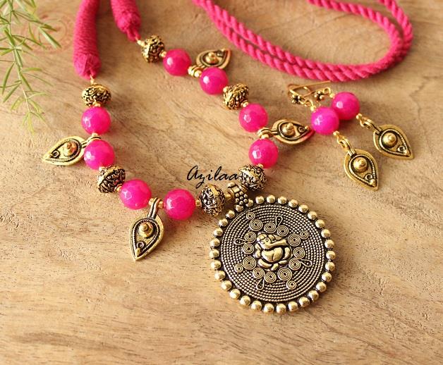 Dark pink ethnic Ganesha antique gold tone necklace set