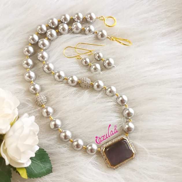 Elegant silver pearl necklace earrings