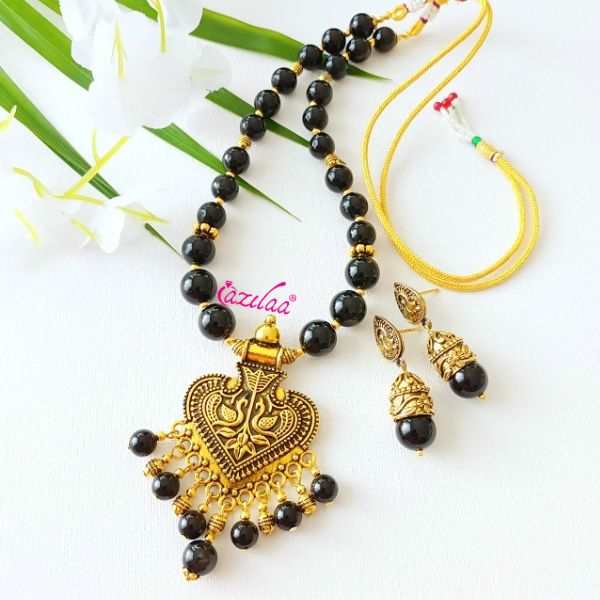 Ethnic black onyx designer golden necklace earrings set