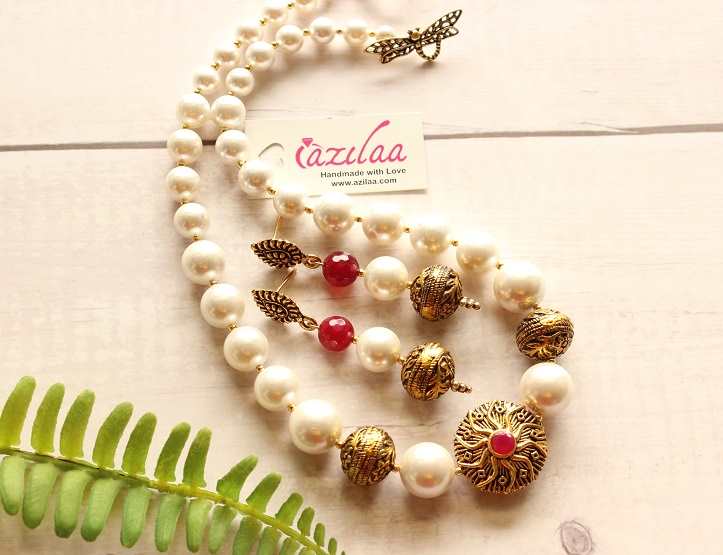 Graduated ruby red Pearl designer golden necklace earrings set at ₹2950 ...