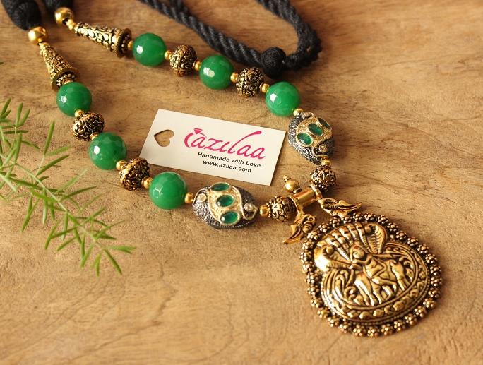 Krishna pendant necklace set with green stone beads