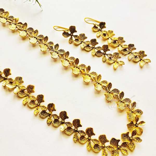 Modern Golden flower long necklace and earrings set at ?2450 | Azilaa