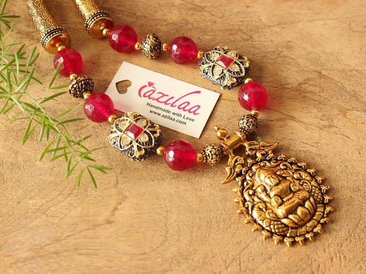 Laxmi pendant maroon beads necklace earrings set